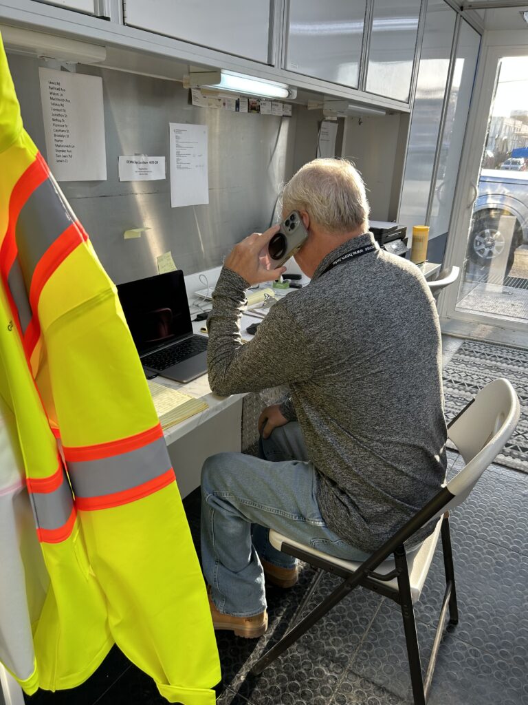 Kevin Cox taking a phone call from the Hope City Command Center in Pajaro