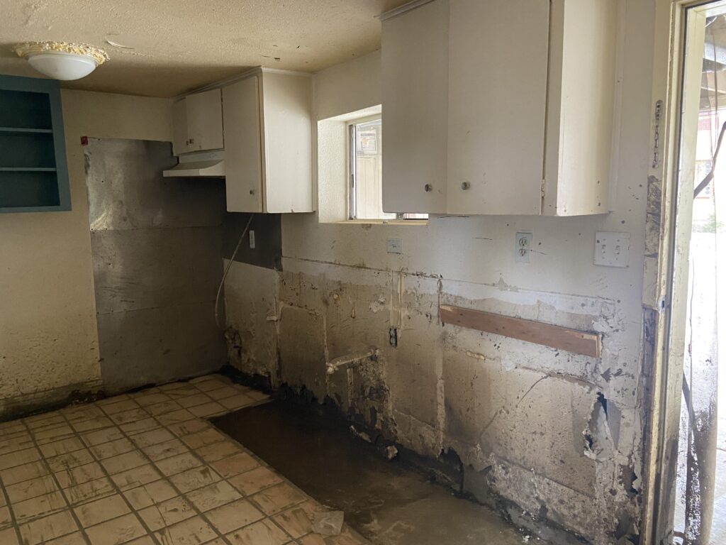 A damaged kitchen in Pajaro, California. Appliances were damaged due to flooding and removed.