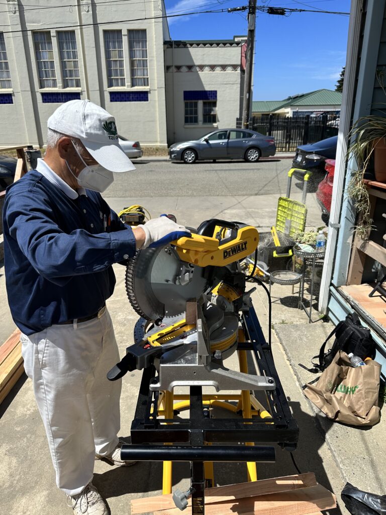A volunteer in Pajaro, CA assists with repair work